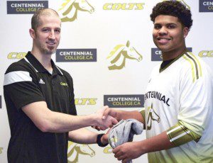 College Coach shaking hands with Recruit